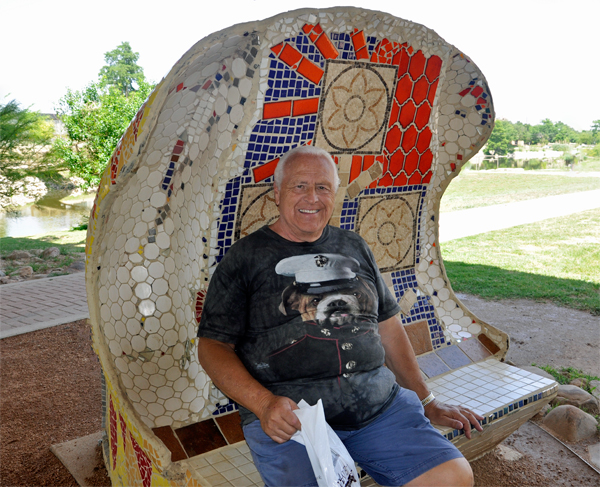 Lee takes a rest on the clamshell bench