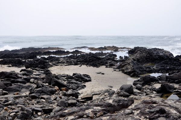 uneven volcanic rock and sand