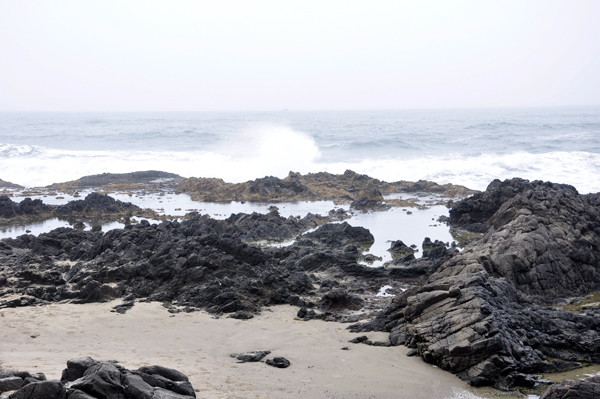 uneven volcanic rock and sand