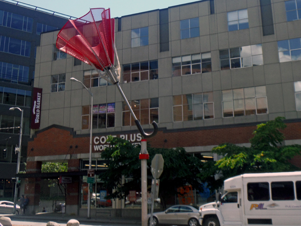 a big red umbrella sculpture