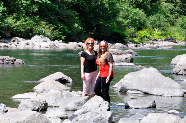 Karen and her sister carefully maneuvering over the rocks.