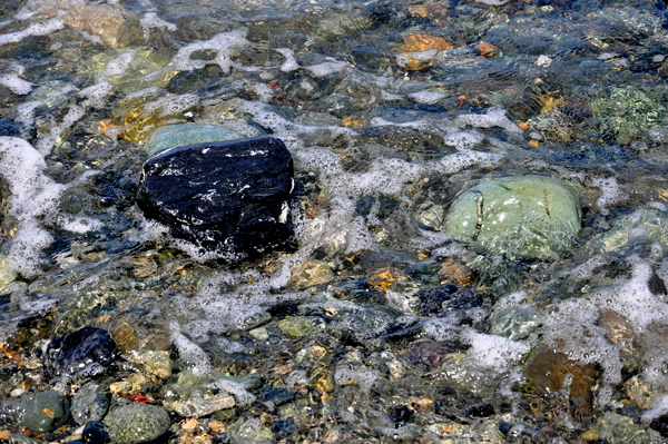 clear water and sparkling rocks