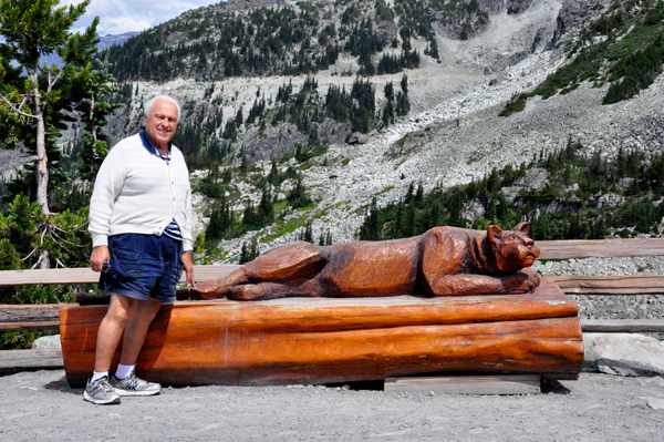 Lee Duquette and a carved bench