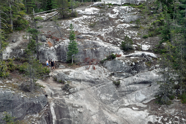 people hiking up the mountain