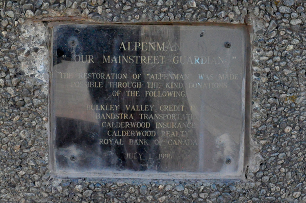 Alpine man statue plaque