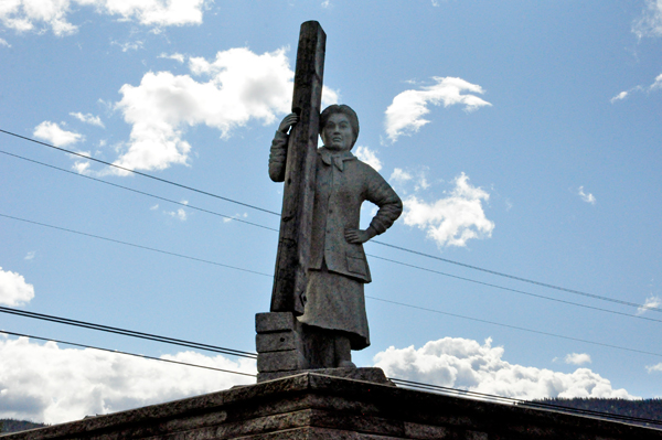 Woman Holding Railroad Tie statue