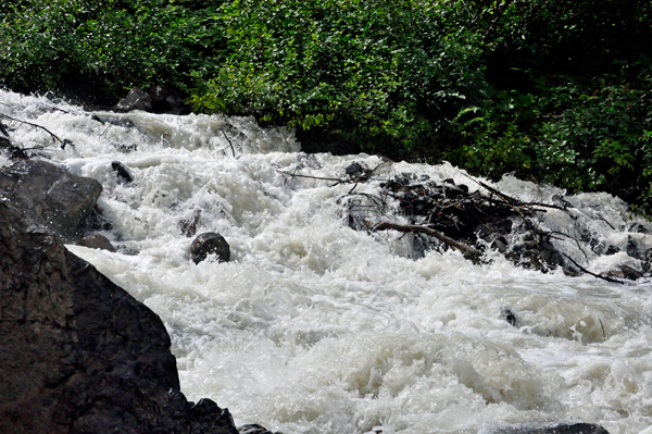 the tumbling creek created by the runoff water from the waterfalls