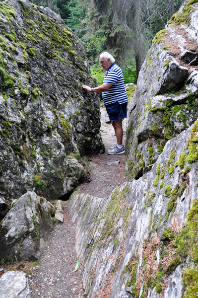 Lee Duquette examines the moss covered rocks