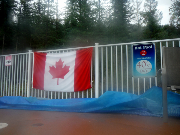 Canadian flag and pool temperature sign