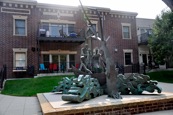 sculpture in front of an apartment