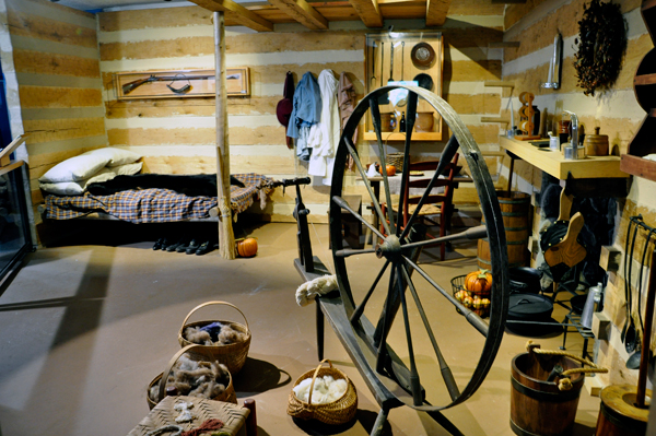 a replica of the inside of a typical log cabin