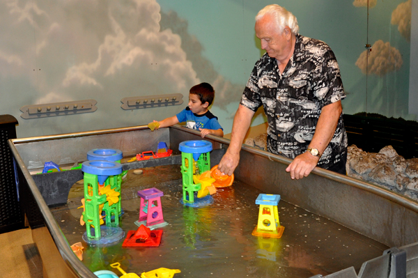 Lee and Anthony playing with boats