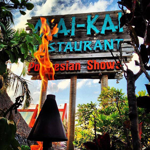 The Mai-Kai Restaurant sign and a flame