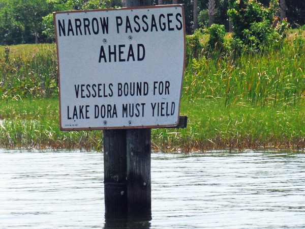 narrow passage sign