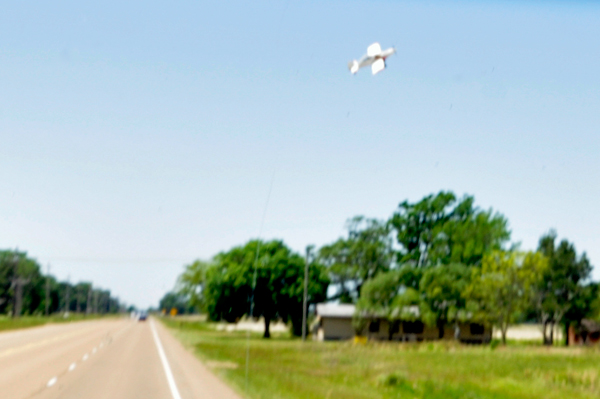 a small plane dipping its wing