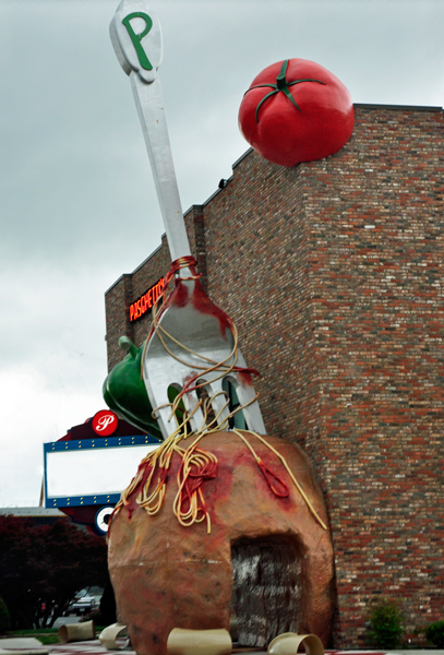 giant meatball, fork, tomato and pepper