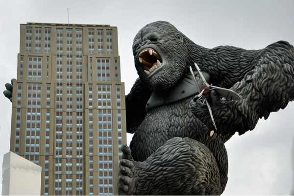 King Kong holding an airplane