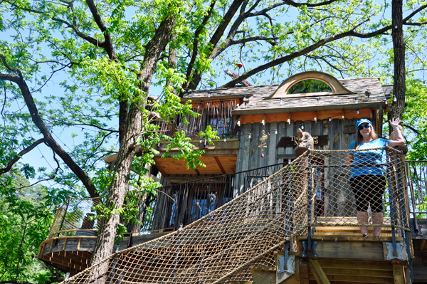 Karen Duquette on the balcony of the treehouse