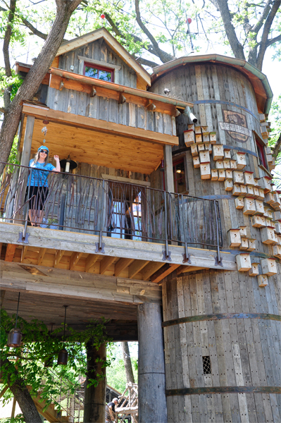 Karen Duquette on the balcony of the treehouse