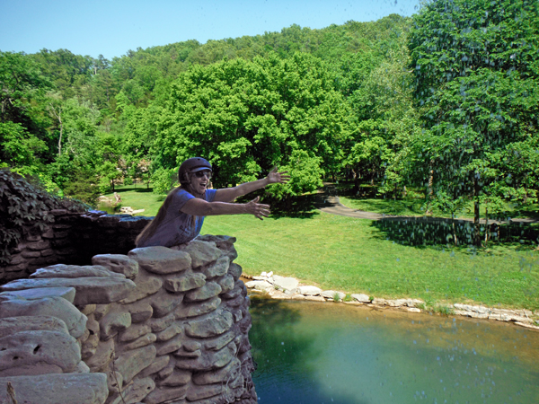 Karen Duquette and waterfall at Great Spirit Rock Shelter