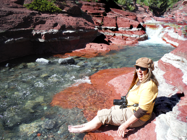 Karen Duquette sticks her feet in icy water