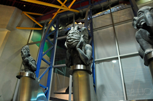 statues at the top of the escalator