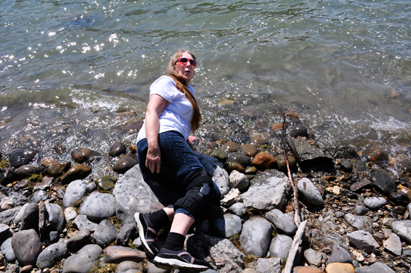 Karen Duquette with her hand in the very cold water