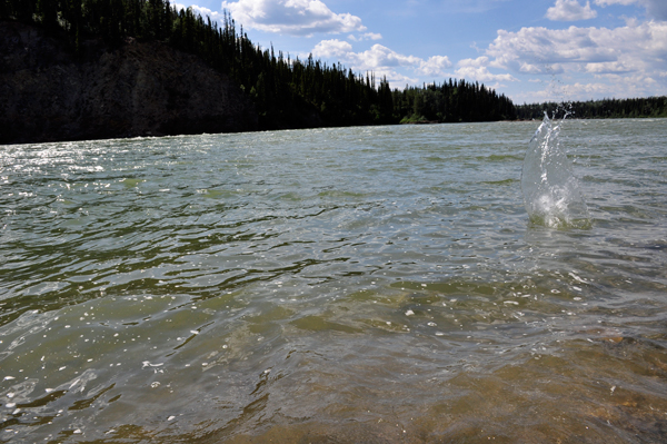 skipping rocks into Liard River