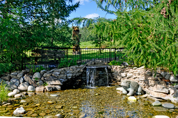 waterfall and bear at Georgeson Botanical Garden
