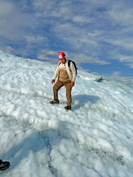 Lee Duquette walking up a hill of ice.