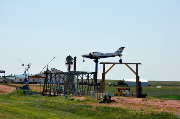 airplane on a tall log