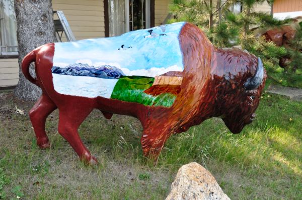 mountain and water and birds on painted bison