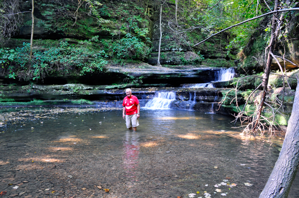 Lee Duquette by a small waterfall