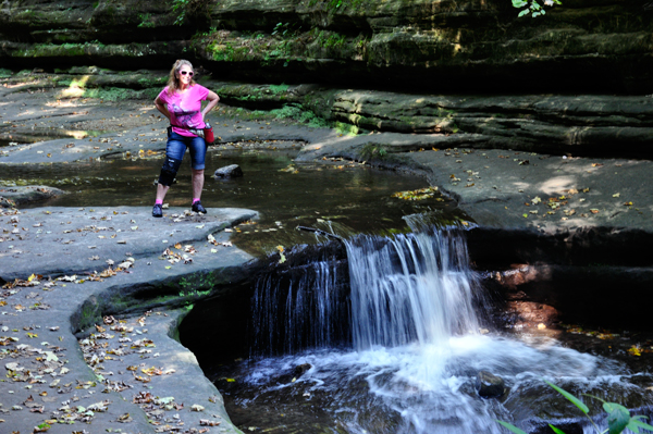 Karen Duquette at the top of the waterfall