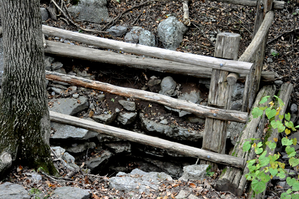 looking down at the closed entrance to Hermit Cave