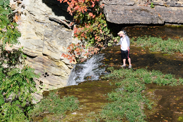 a person risking his life at Burgess Falls