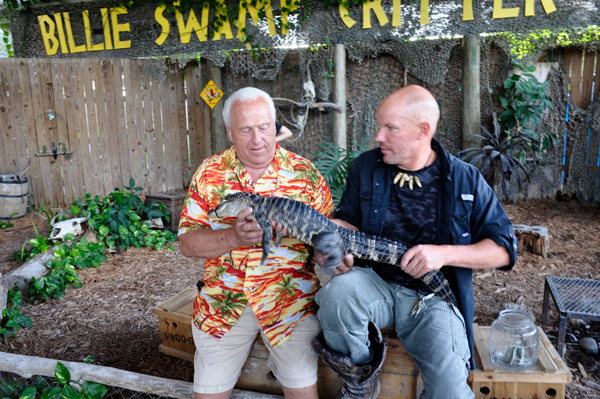 Lee Duquette holding a baby alligator.