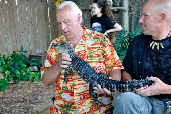 Lee Duquette holding a baby alligator.