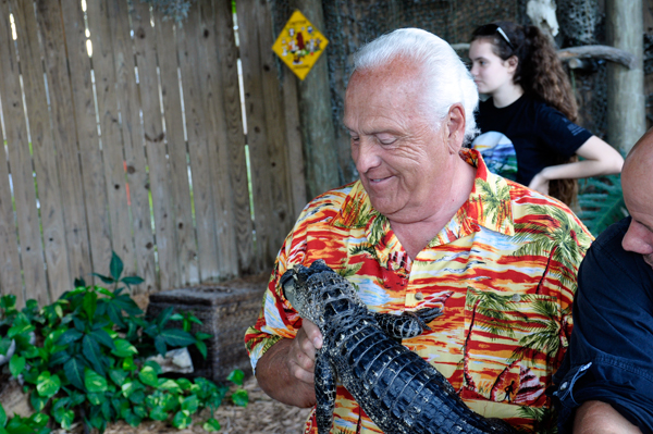 Lee Duquette holding a baby alligator.