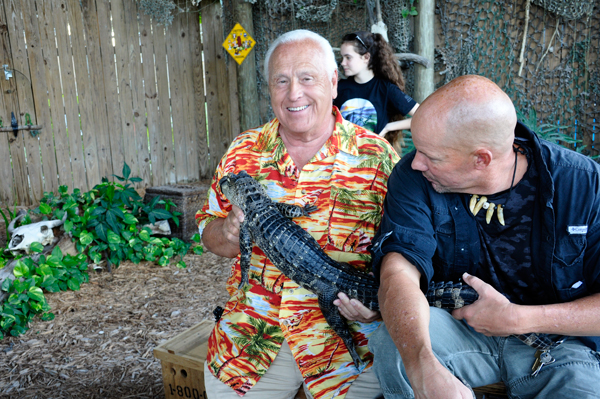 Lee Duquette holding a baby alligator.