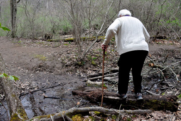 a careful Lee Duquette on a log