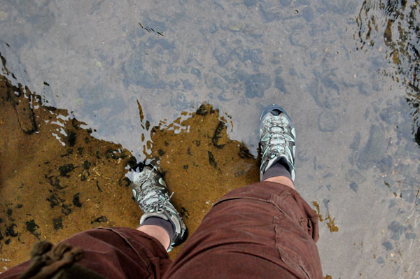 Karen Duquette's feet in the river