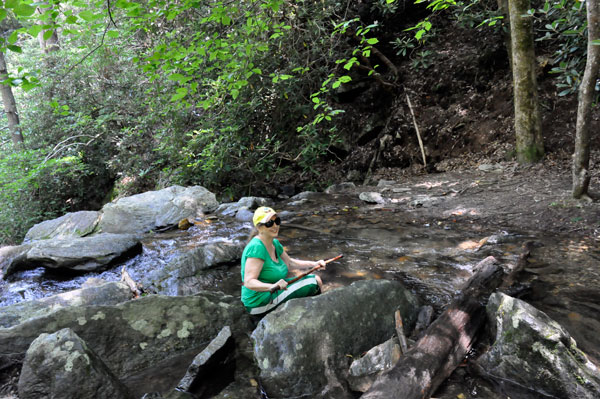 Karen Duquette sitting in the water