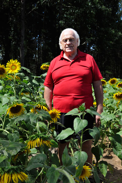 Lee Duquette in a field of sunflowers