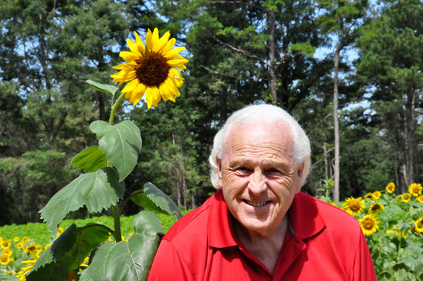 Lee Duquette in a field of sunflowers