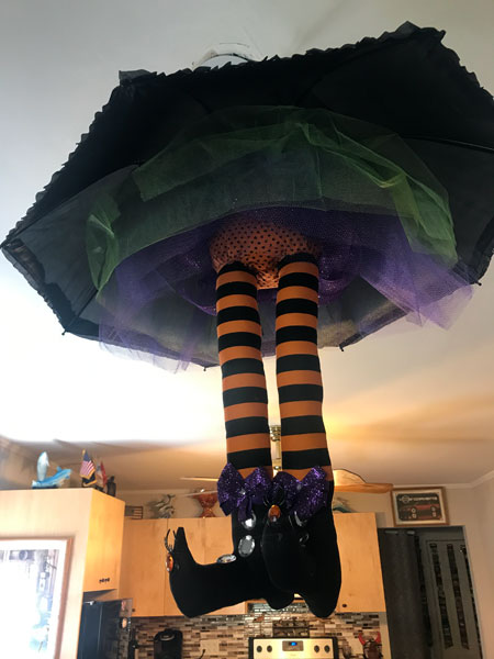 Witch hanging from an umbrella