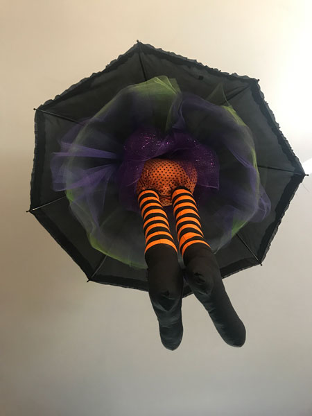Witch hanging from an umbrella