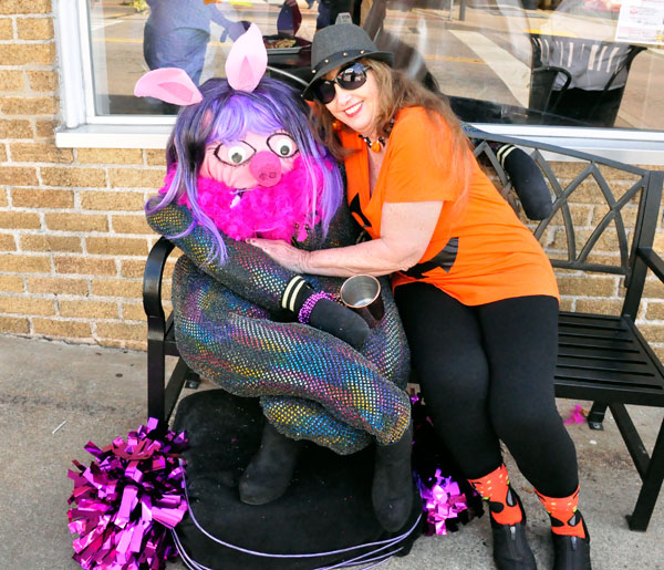 Karen Duquette and the pink piggy scarecrow