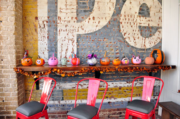 small pumpkins on a shelf