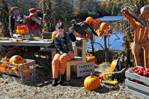 Karen Duquette and a Halloween pumpkin display